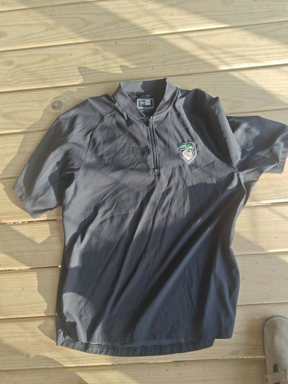 New Era Cage Short Sleeve 1/4 Zip Performance Jacket